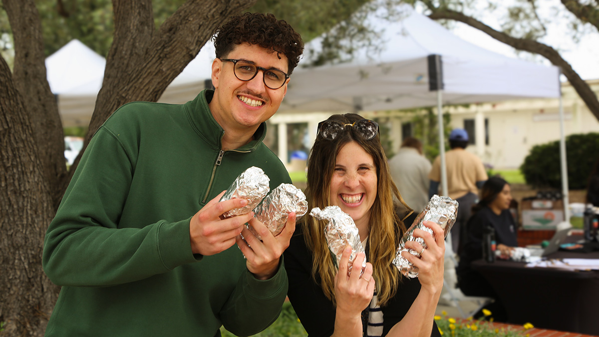 BNC team meber displaying Calfresh pamphlets and info